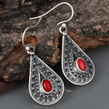Silver water drop earrings with red pine gemstone centre on zinc alloy body