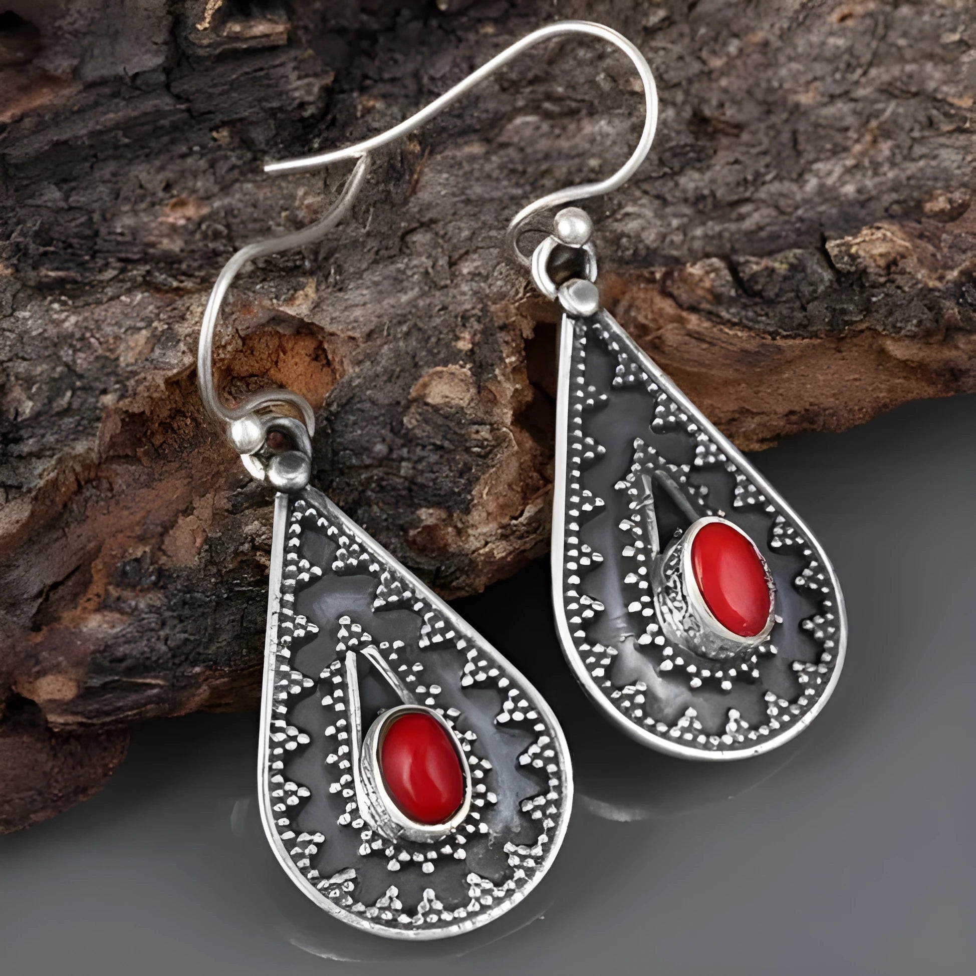 Silver water drop earrings with red pine gemstone centre on zinc alloy body