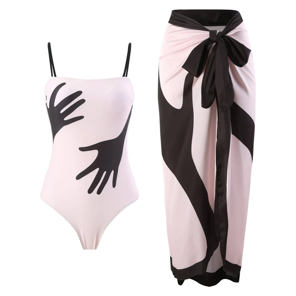 Women's patterned one-piece bikini swimsuit with an attached light tulle skirt.
