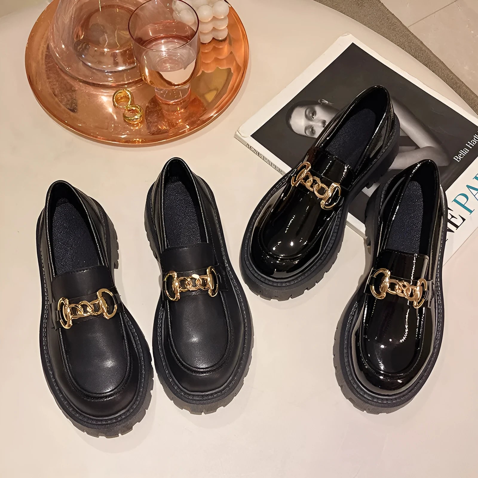 British retro round toe flat heel shoes for women in black glossy finish showing side view