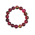 Handmade watermelon crystal bracelet for women showing pastoral design on a wrist.
