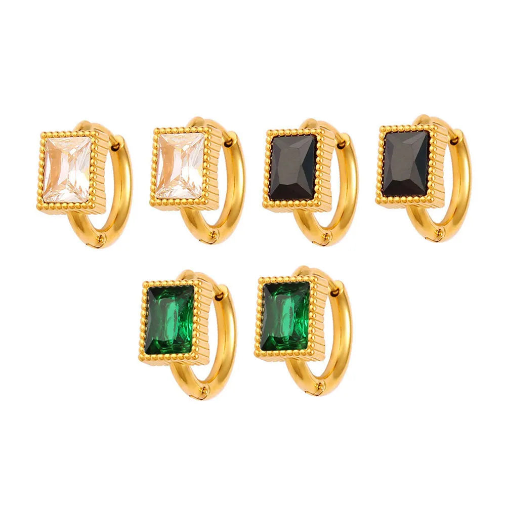 Square stainless steel earrings with round ring design elements in white, black and green colour options