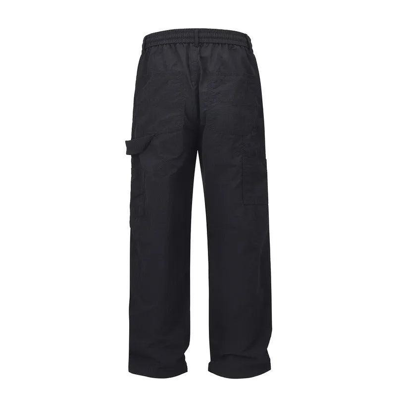 Men's black baggy paratrooper pants with elastic drawstring waist, three-dimensional cutting, acetate fibre blend