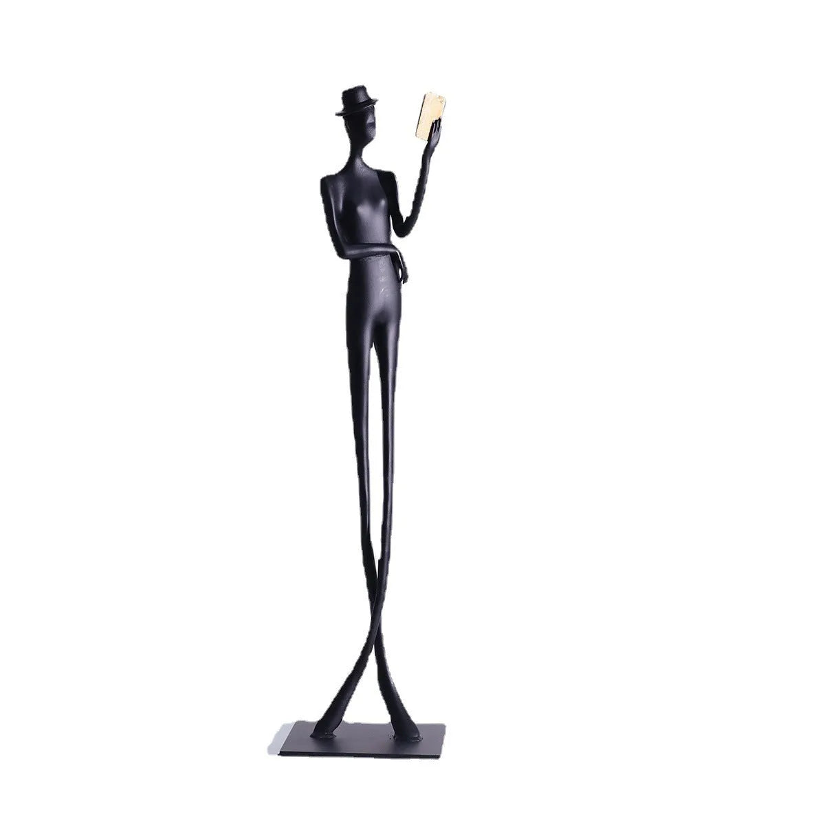 Black cast aluminium reading woman sculpture on desk, modern minimalist design