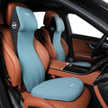 Black memory foam automotive waist cushion and headrest lumbar support pillow set on a car seat.