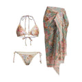 Women's floral print bikini set with skirt in creamy-white beige, shown on a mannequin