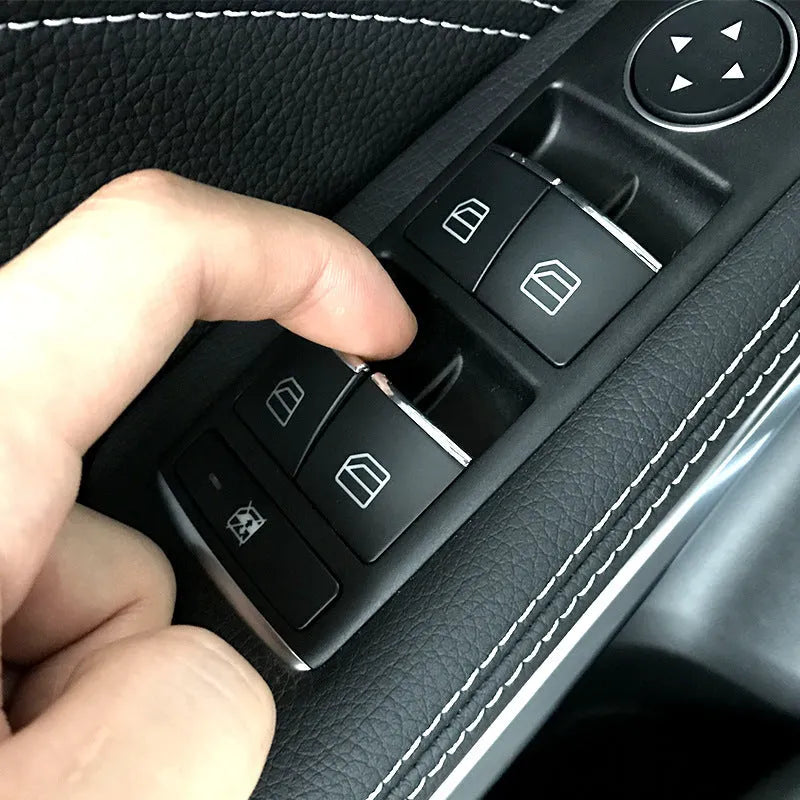 Black glitter decorative sticker for a car window lift button on a door panel