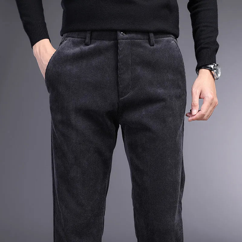British retro style straight-leg striped trousers in a neutral colour on a hanger.