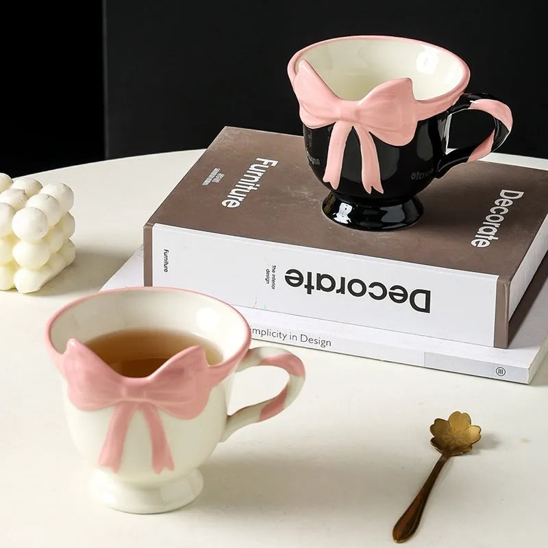 Ceramic mug with heart bow design in white powder or black pink colours, 301-400ml capacity