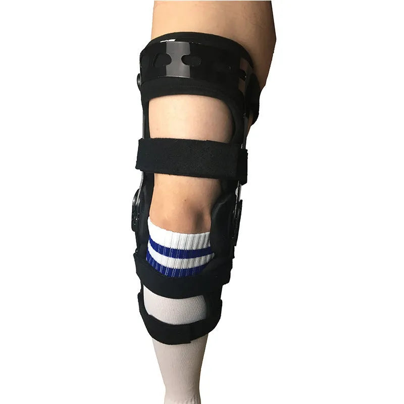 Black anterior cruciate ligament knee brace with visible metal side stays and hinges on a leg.