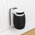 White automatic cat self groomer mounted in a wall corner with soft silicone bristles for grooming and massage