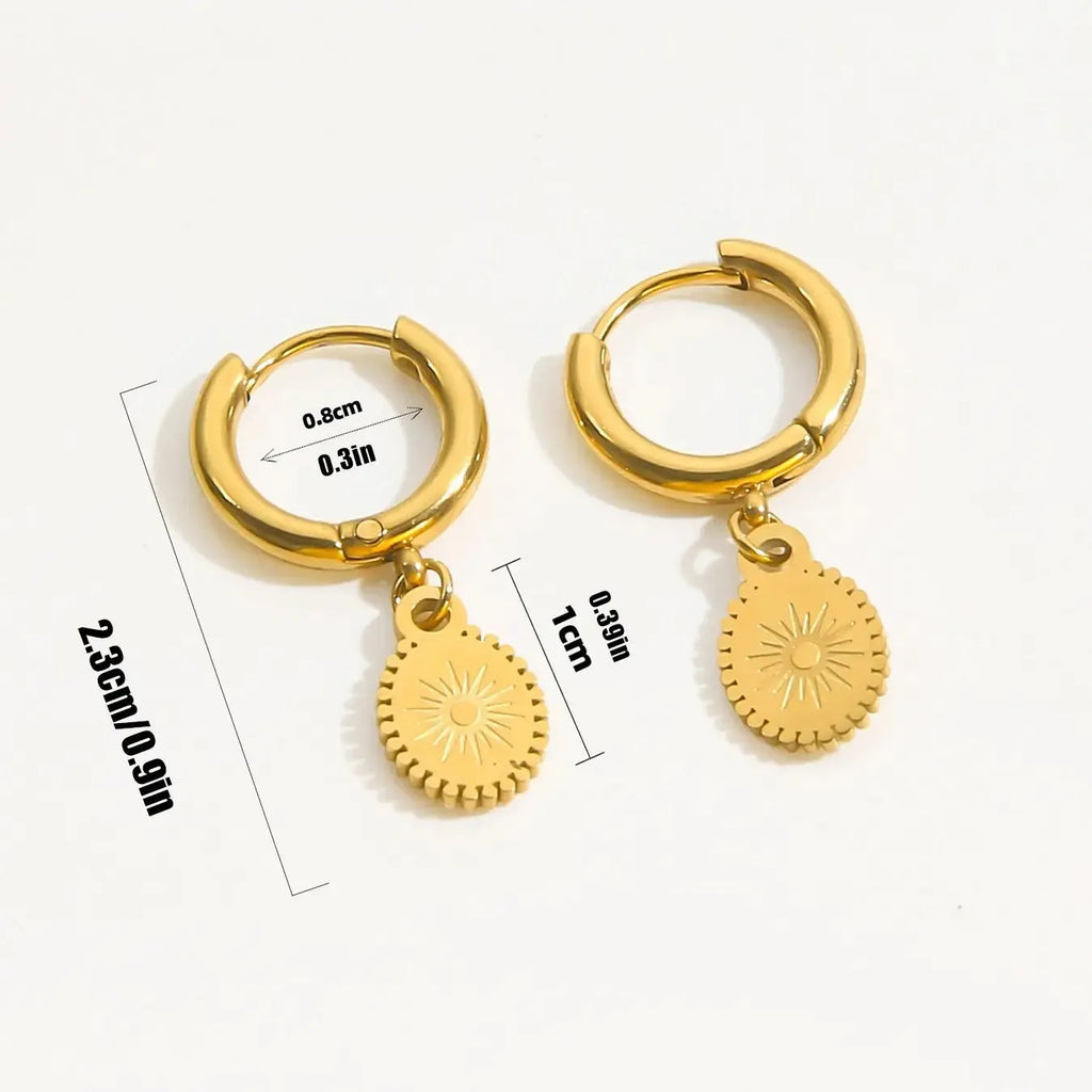 Geometric elliptical stainless steel earrings with an ear button fastening on a white background.