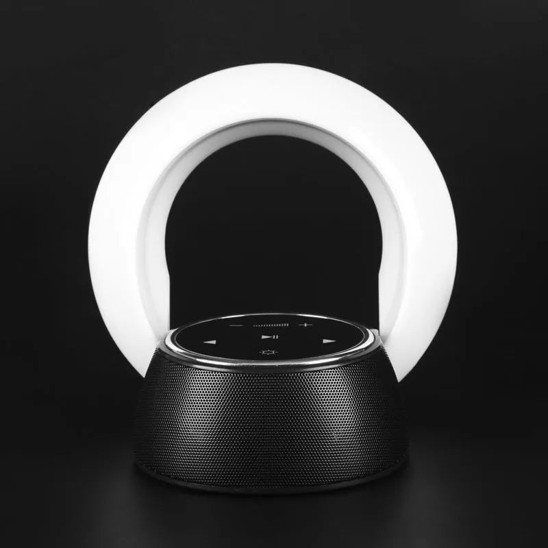 Blue folding Bluetooth desk lamp speaker with touch controls and LED light.