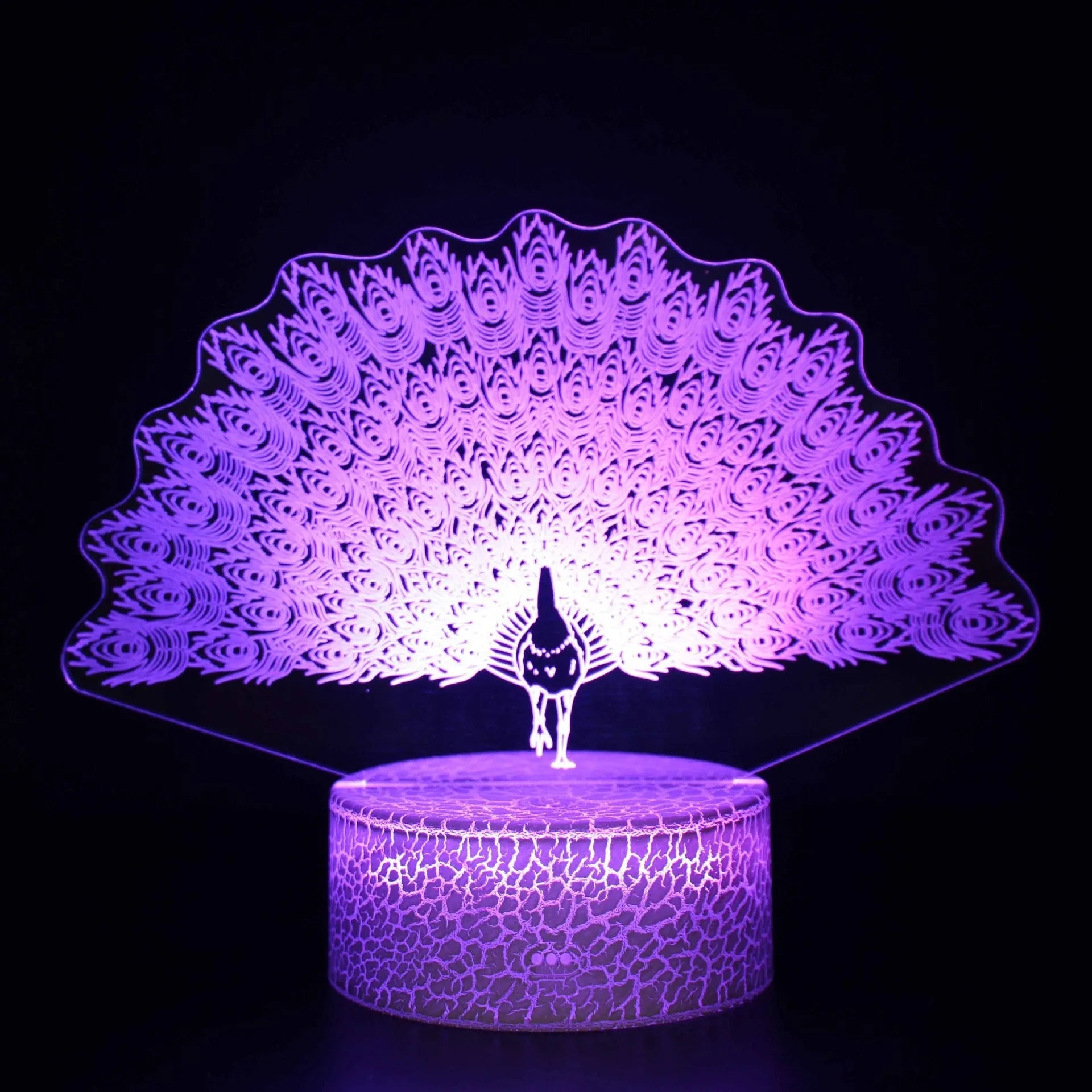 Small colourful acrylic 3D USB table lamp with touch control and crack base design on a desk.