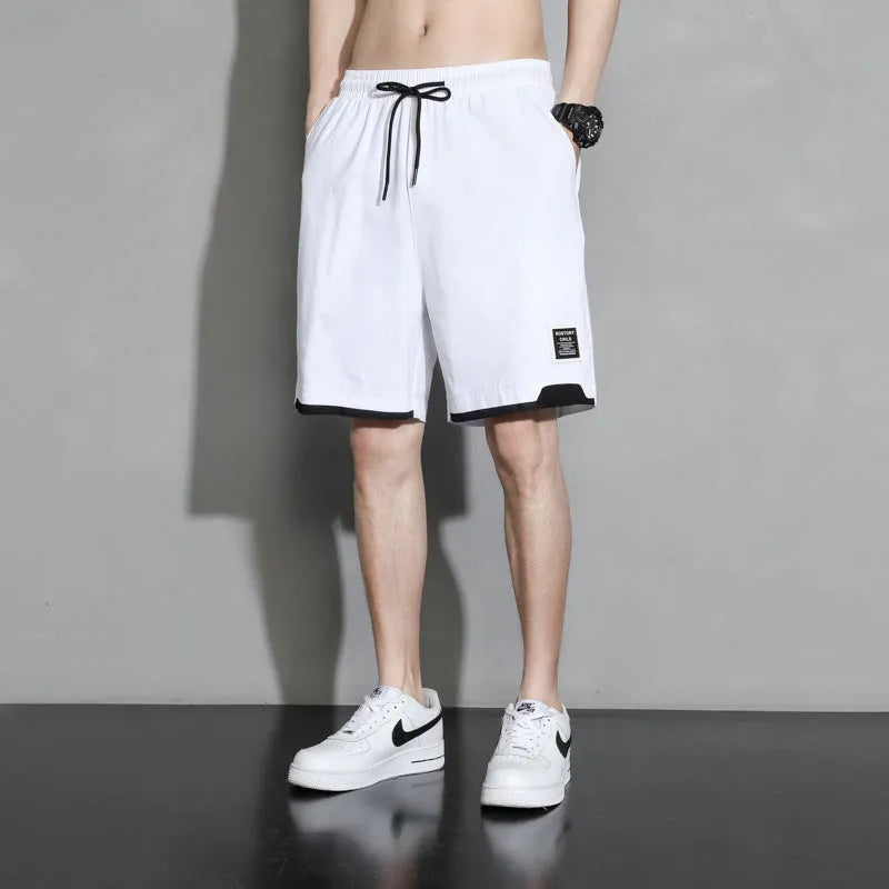 Boys' plus size cotton shorts in black, shown flat, featuring a mid waist and shorts length design.