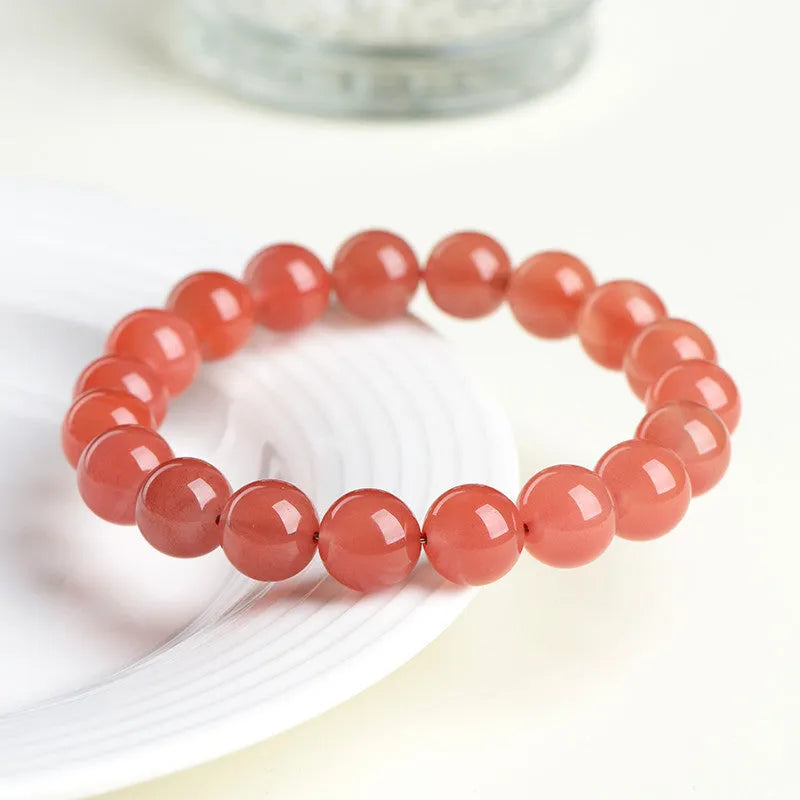 Natural cherry red agate scattered bead bracelet with polished stones.