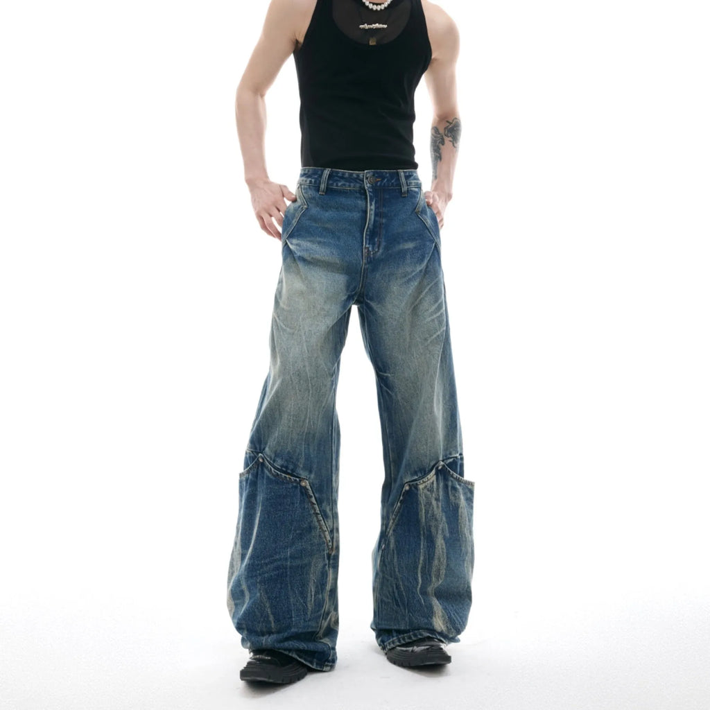 Men's verdant blue jeans with washed burst pattern and curved knife design detail