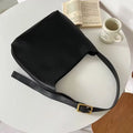Women's soft PU shoulder bag with swing threads in black ribbon or brown colour options