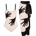 Women's patterned one-piece bikini swimsuit with an attached light tulle skirt.