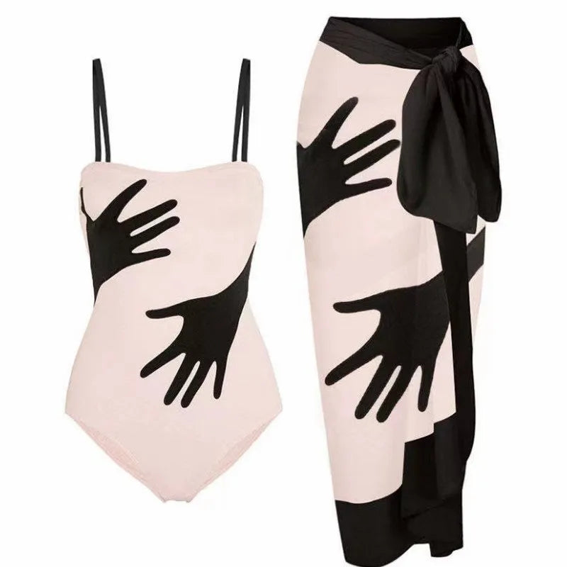 Women's patterned one-piece bikini swimsuit with an attached light tulle skirt.