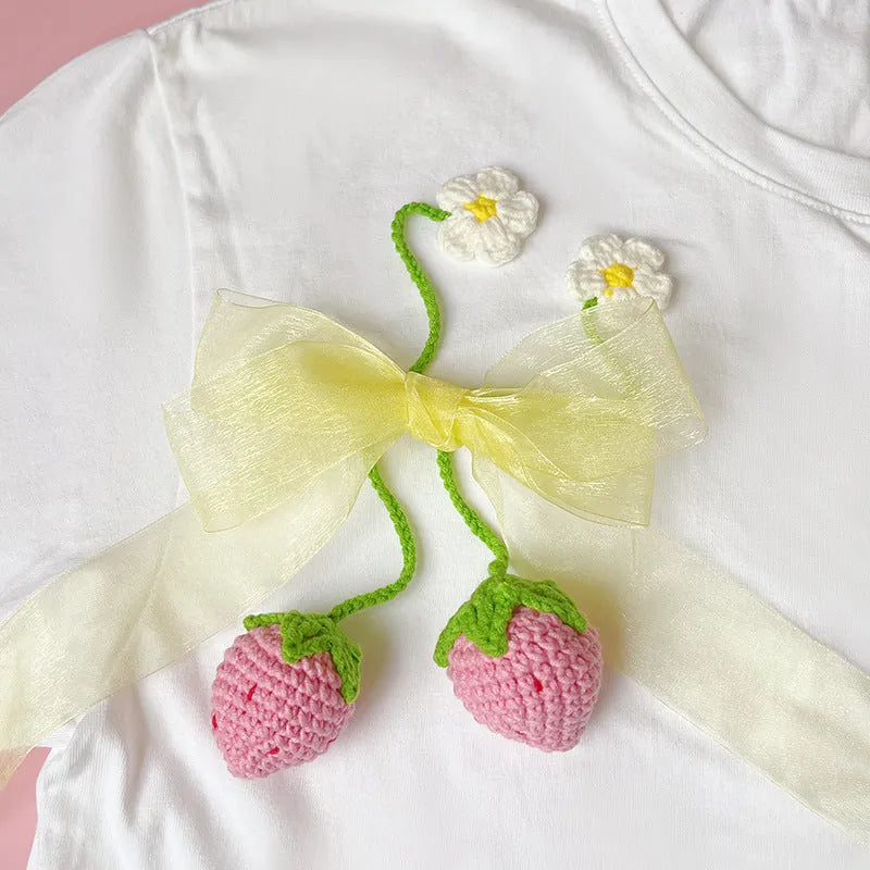 Wool crochet strawberry pendant necklace with woven design on 35cm cord