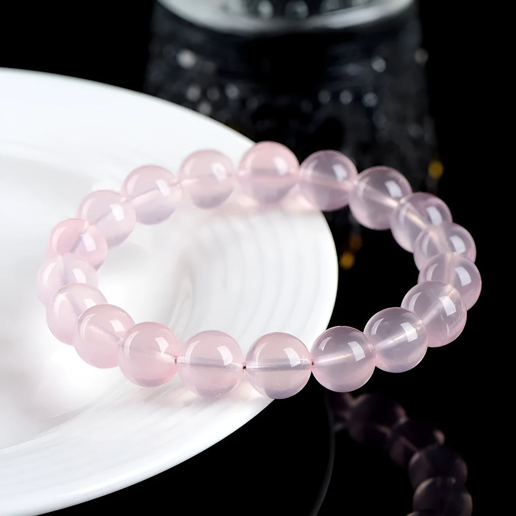 Natural starlight crystal round bead bracelet with polished finish in pink colour options