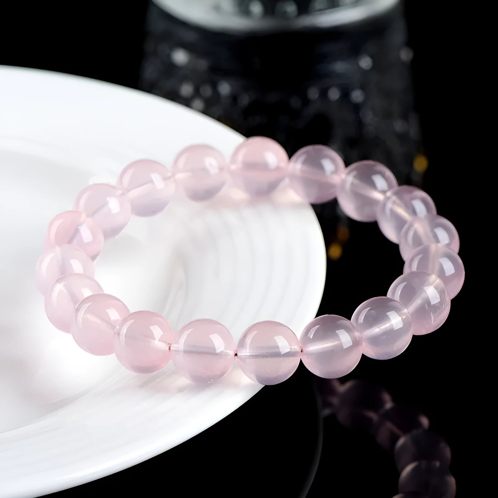 Natural starlight crystal round bead bracelet with polished finish in pink colour options