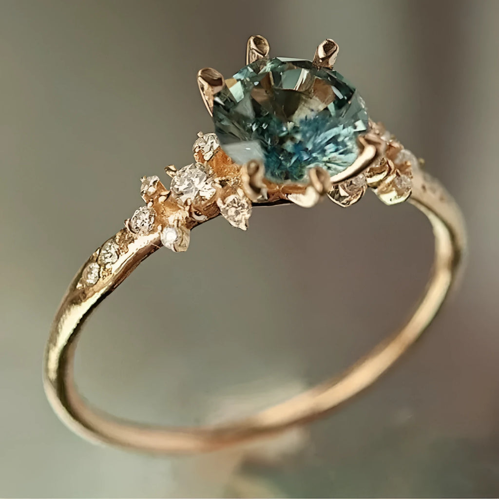 Gold plated unisex ring with a claw-set zircon stone and geometric chamfered square pattern band.