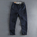 Men's khaki work trousers with a NI buckle belt closure and straight leg
