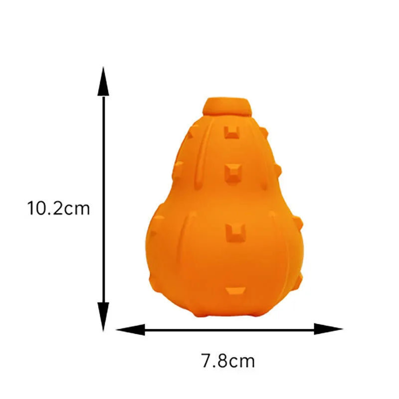 Natural rubber dog toy with treat-dispensing hollow centre and longer strap for fetch and tug