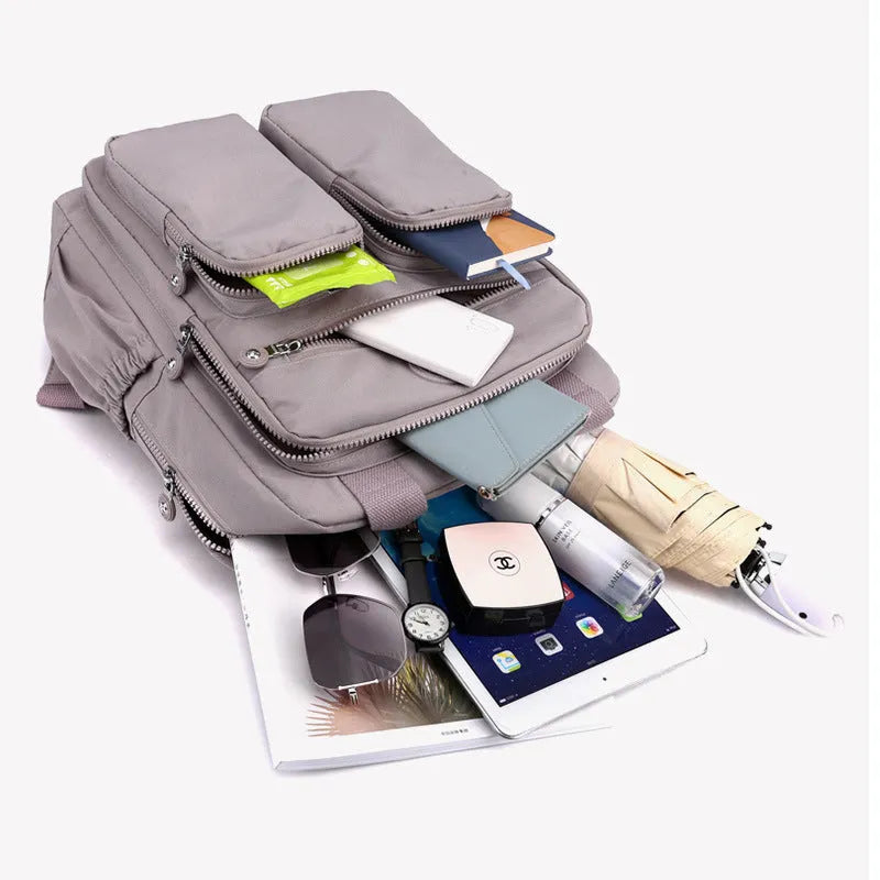 Waterproof travel backpack for women, large capacity, nylon material, multiple pockets, colour options