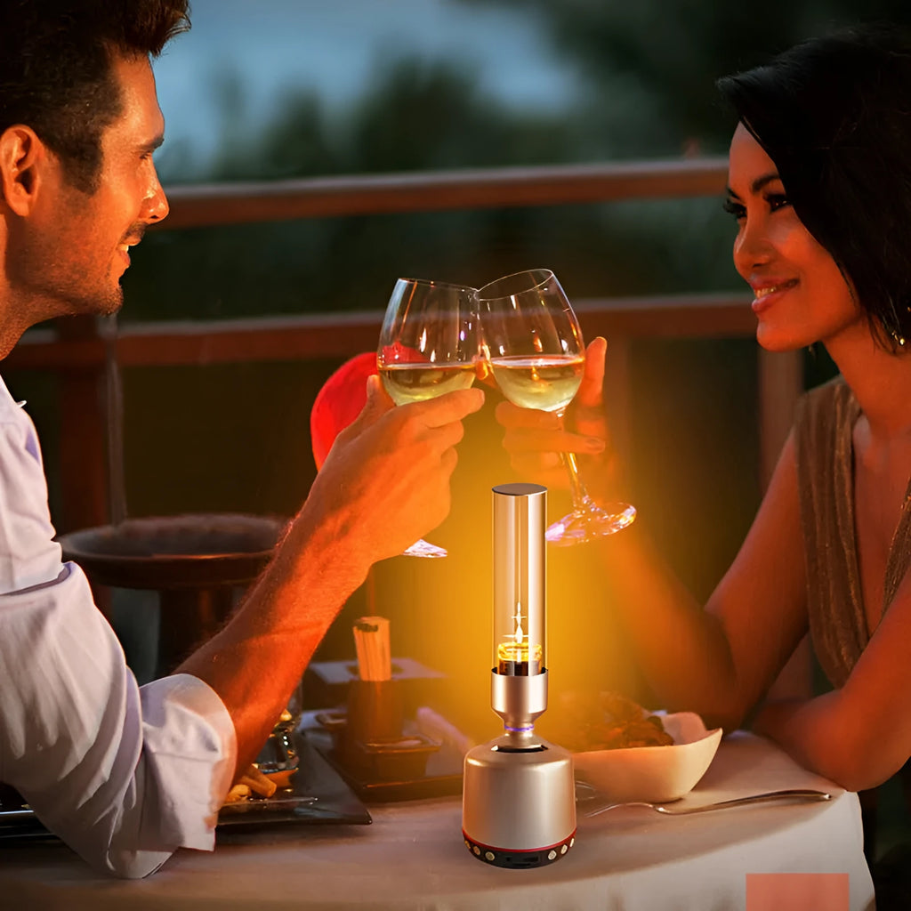 White silver Bluetooth speaker with integrated candlelight atmosphere night light on a table.