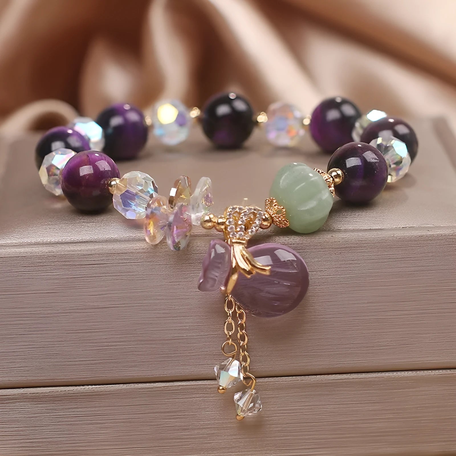 Women's retro transport bracelet with purple tigereye pendant, crystal and rhinestone accents