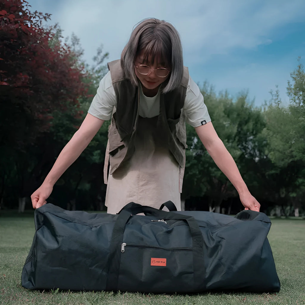 Large black waterproof storage bag for camping tents, tables, and chairs, shown with size dimensions.