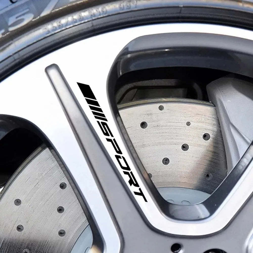 Black sports design car rim sticker on alloy wheel with hollow cut-out pattern