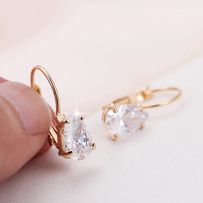 Drop-shaped women's fashion earrings with platinum inlaid gems in gold and platinum colour options