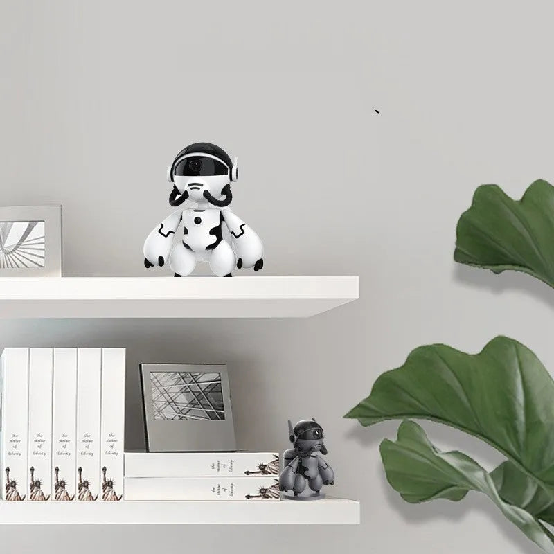 White battery-powered indoor security camera on a table with detachable base.