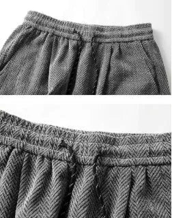 Light grey fleece-lined straight-leg trousers with hollow-out design and elastic waistband.