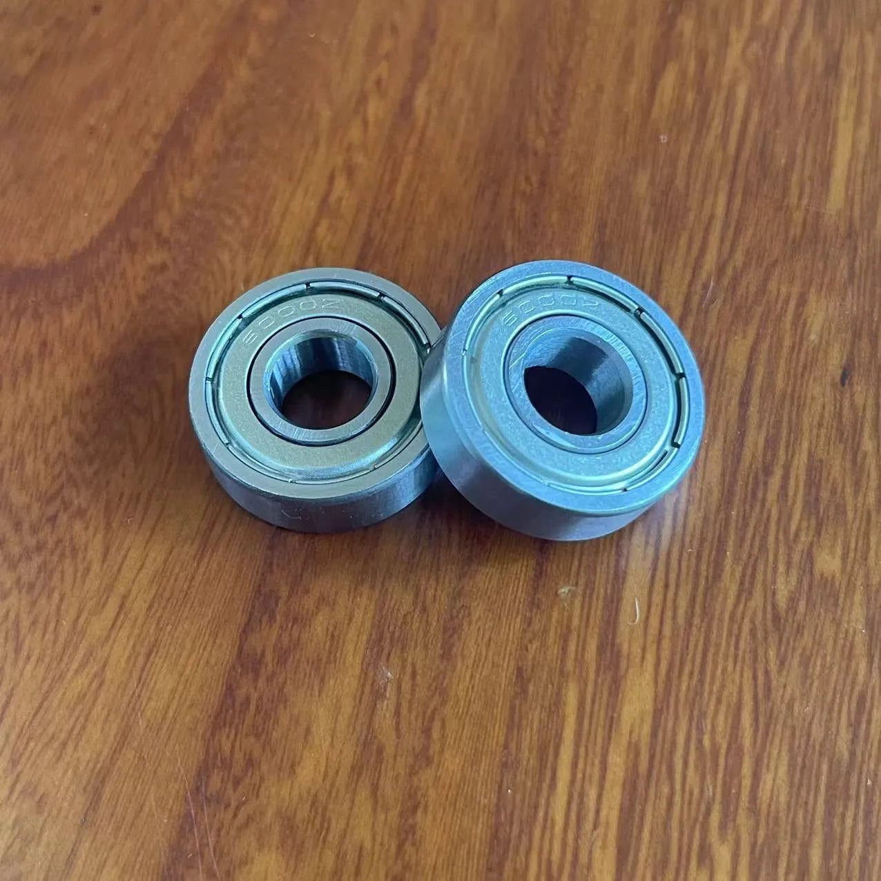 Carbon steel bearing 6000zz with dimensions 10x26x8mm on a white background