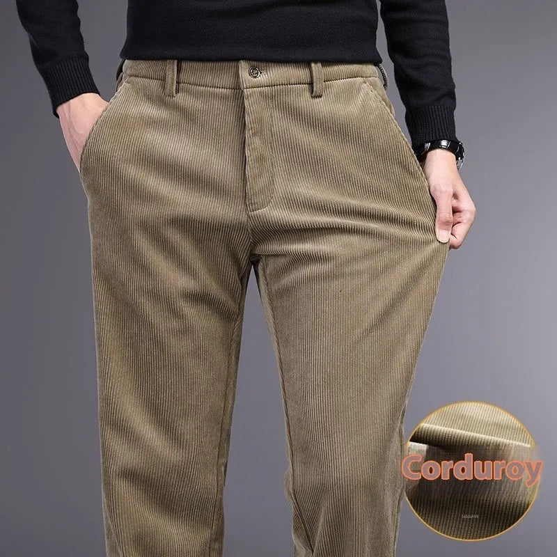 British retro style straight-leg striped trousers in a neutral colour on a hanger.