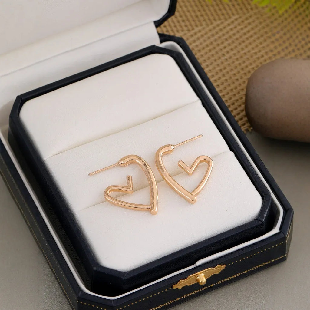 Gold-tone metal simple cold style love dangle earrings for women in golden colour
