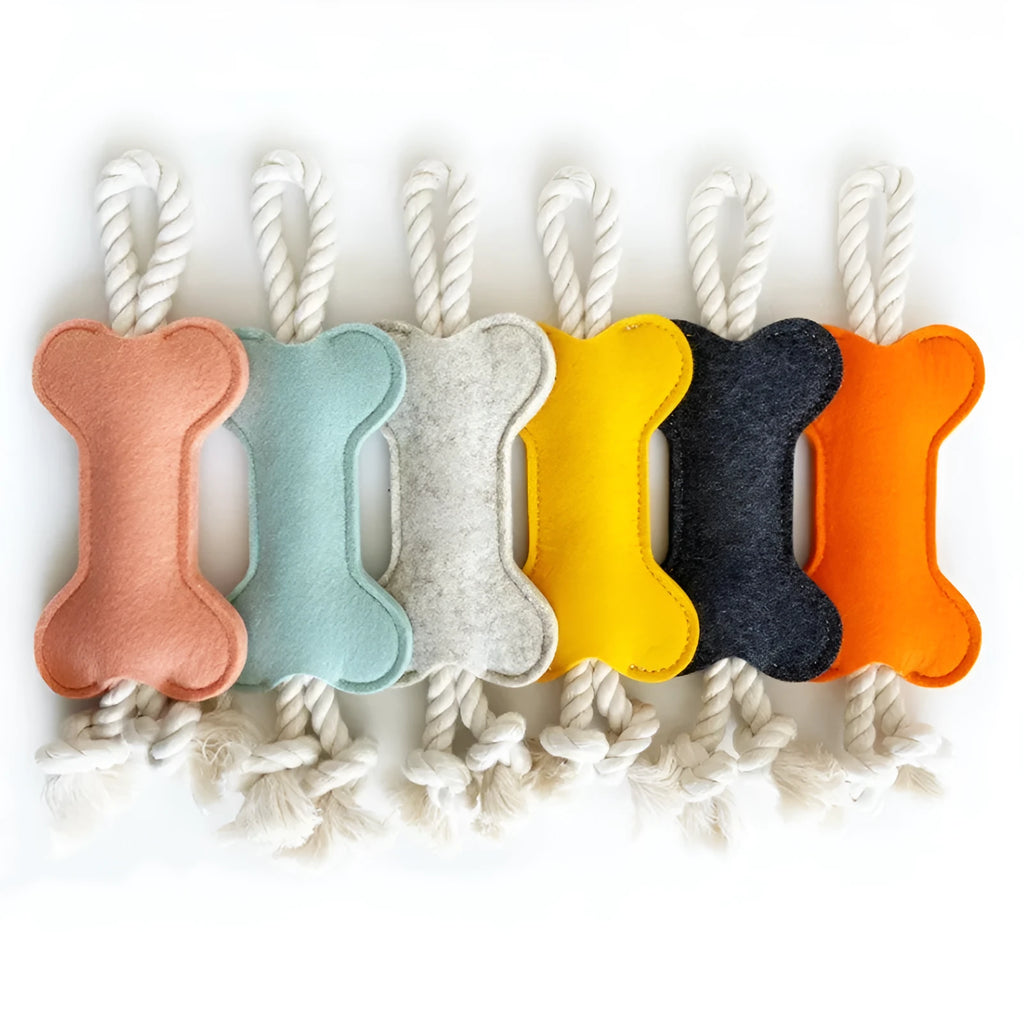 Bone-shaped dog toy with rope knot and felt construction in four colour options