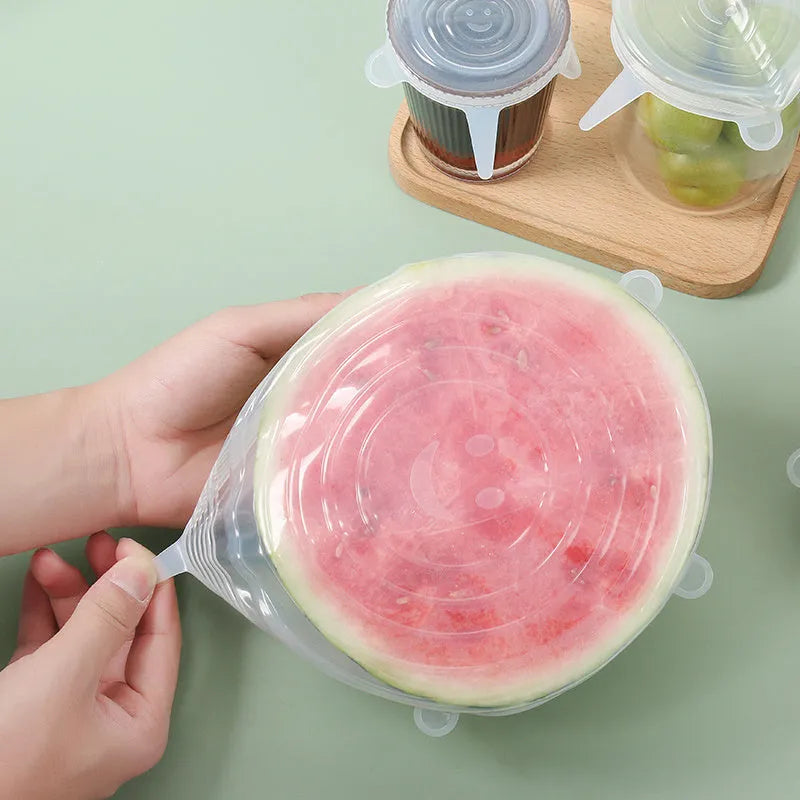 6 silicone food stretch lids in assorted sizes on a kitchen counter for fresh-keeping