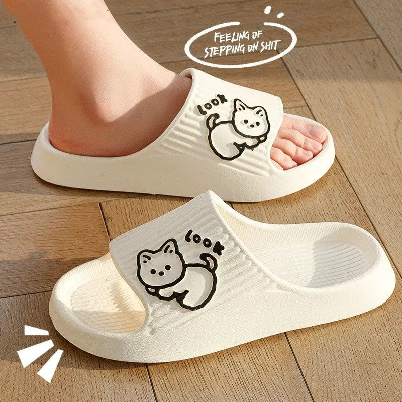 Green EVA platform slippers with a cat design on the upper, showing the thick non-slip sole.