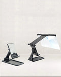 Black folding mobile phone screen amplifier with detachable phone holder magnifying smartphone display