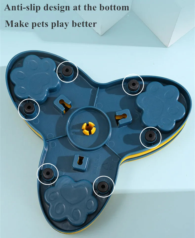 Yellow spinning dog slow food toy carousel on a light background, 24.5cm plastic interactive feeder