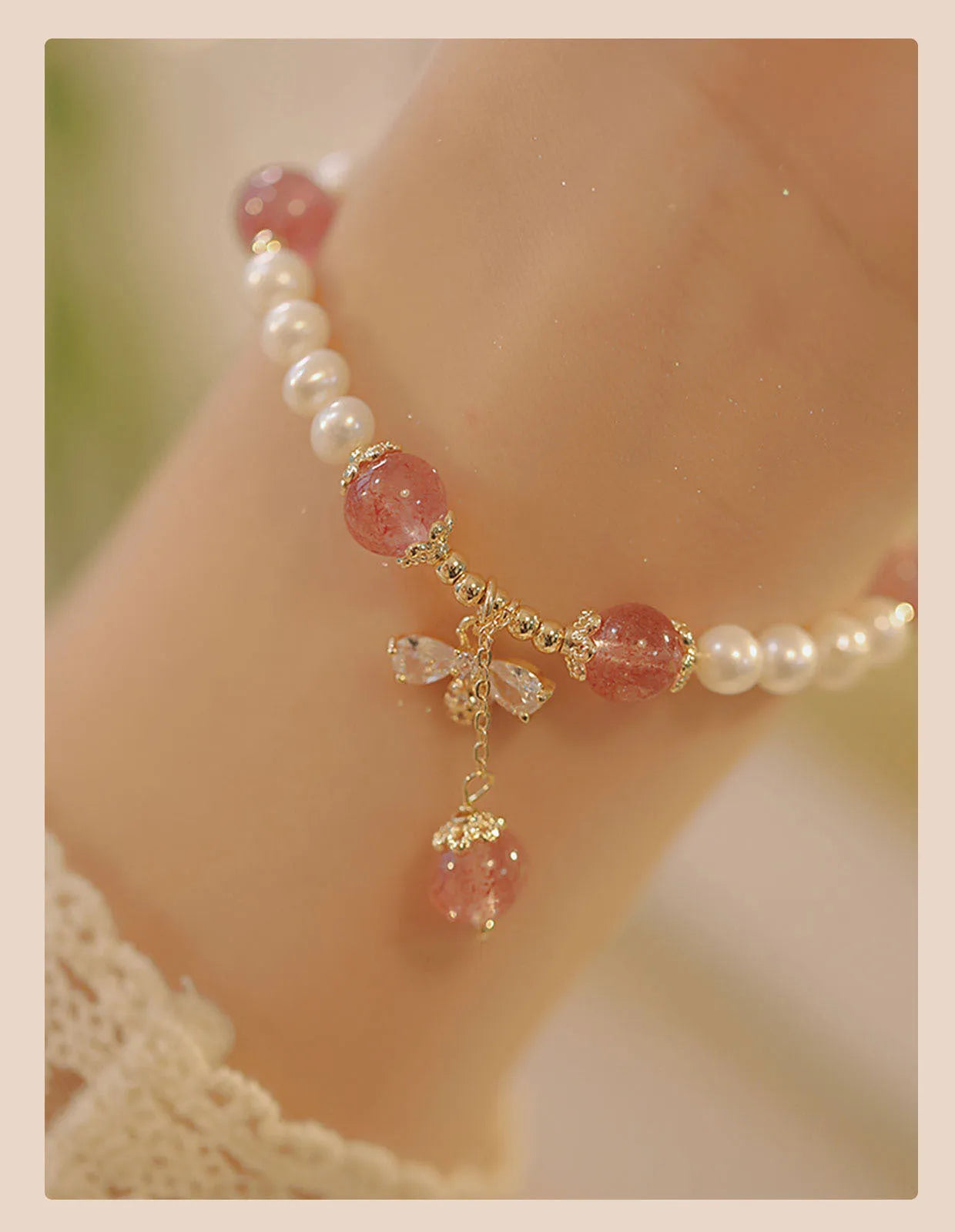 Close-up of a handmade crystal and strawberry quartz bracelet with a bow design, styled for women, INS aesthetic.