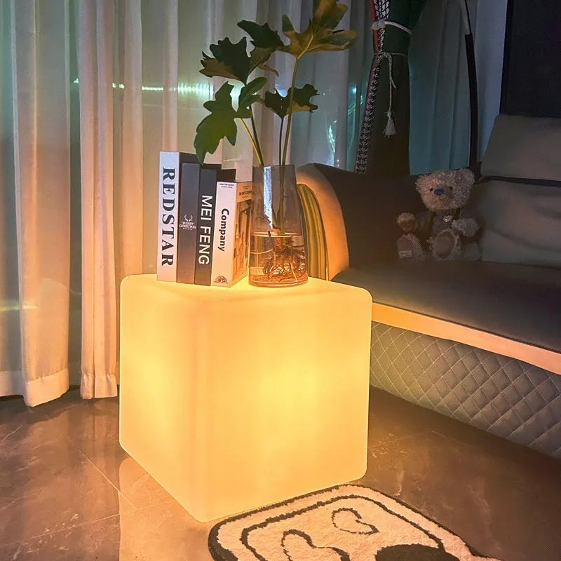 Square LED cube stool light with modern design for outdoor seating and illumination