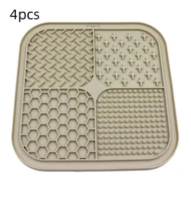 Green silicone pet licking pad 20x20cm with suction cup base on a tiled floor
