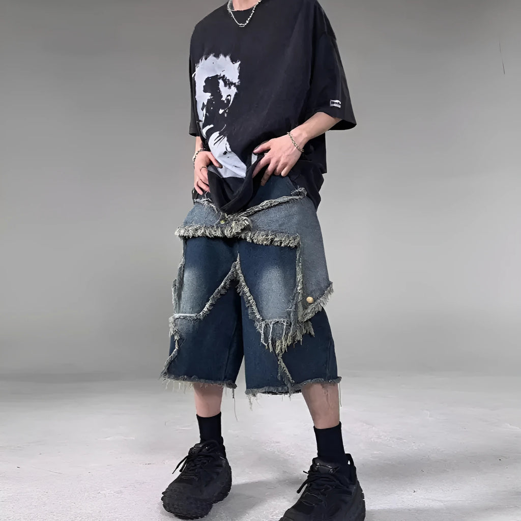 Blue denim shorts with five-pointed star embroidery and frayed edges, loose fit silhouette